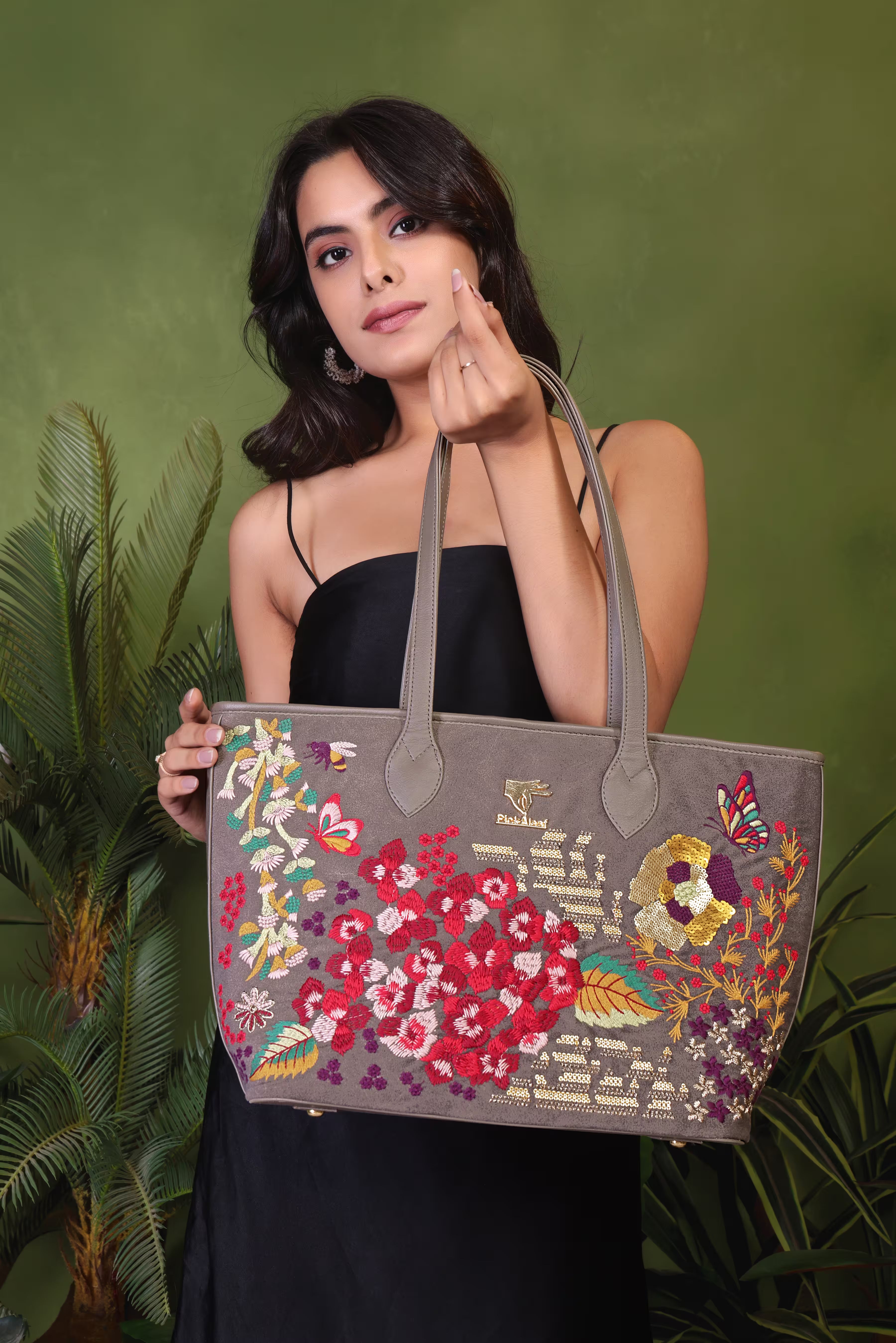 Grey vegan leather embroidered tote bag.