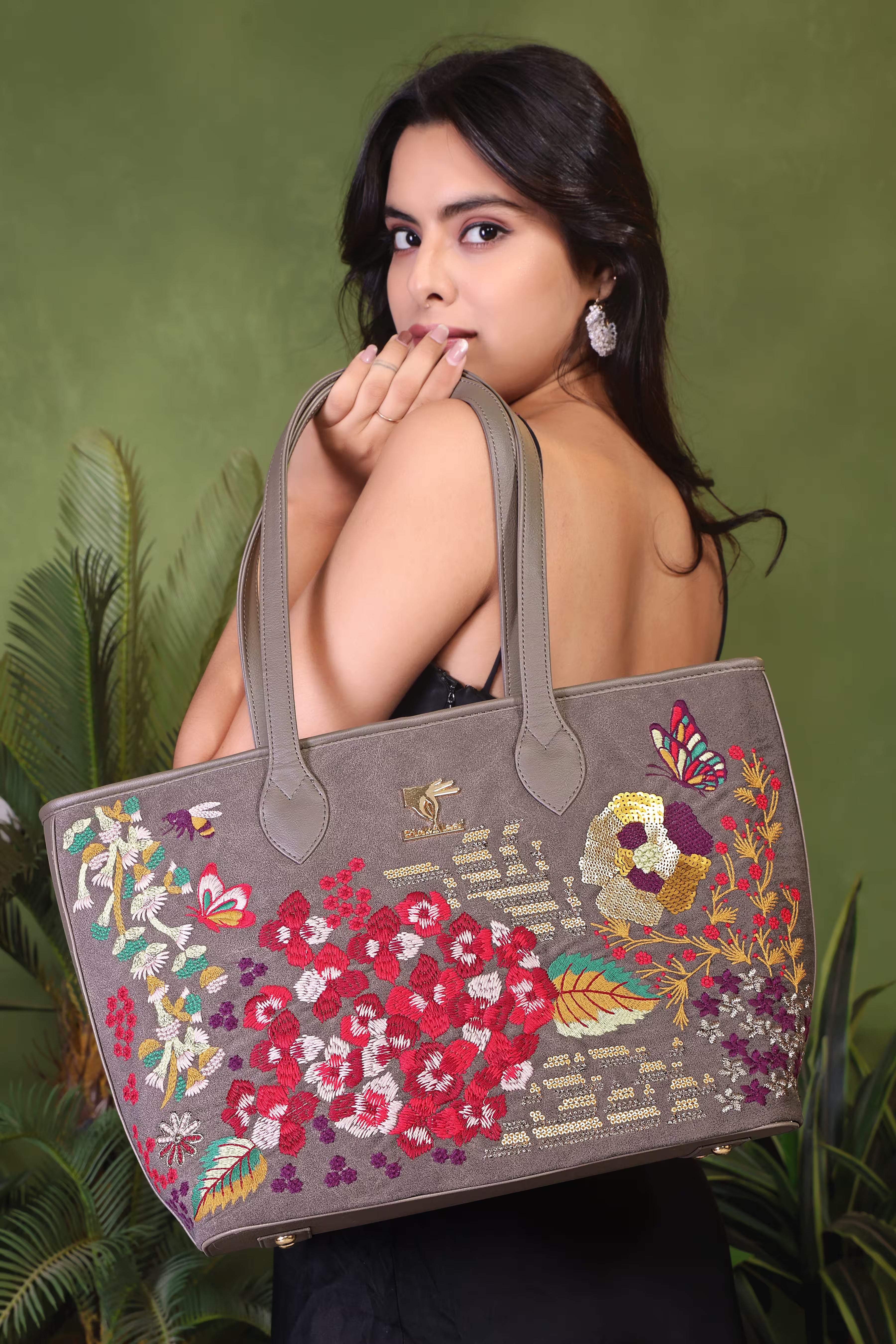 Grey vegan leather embroidered tote bag.