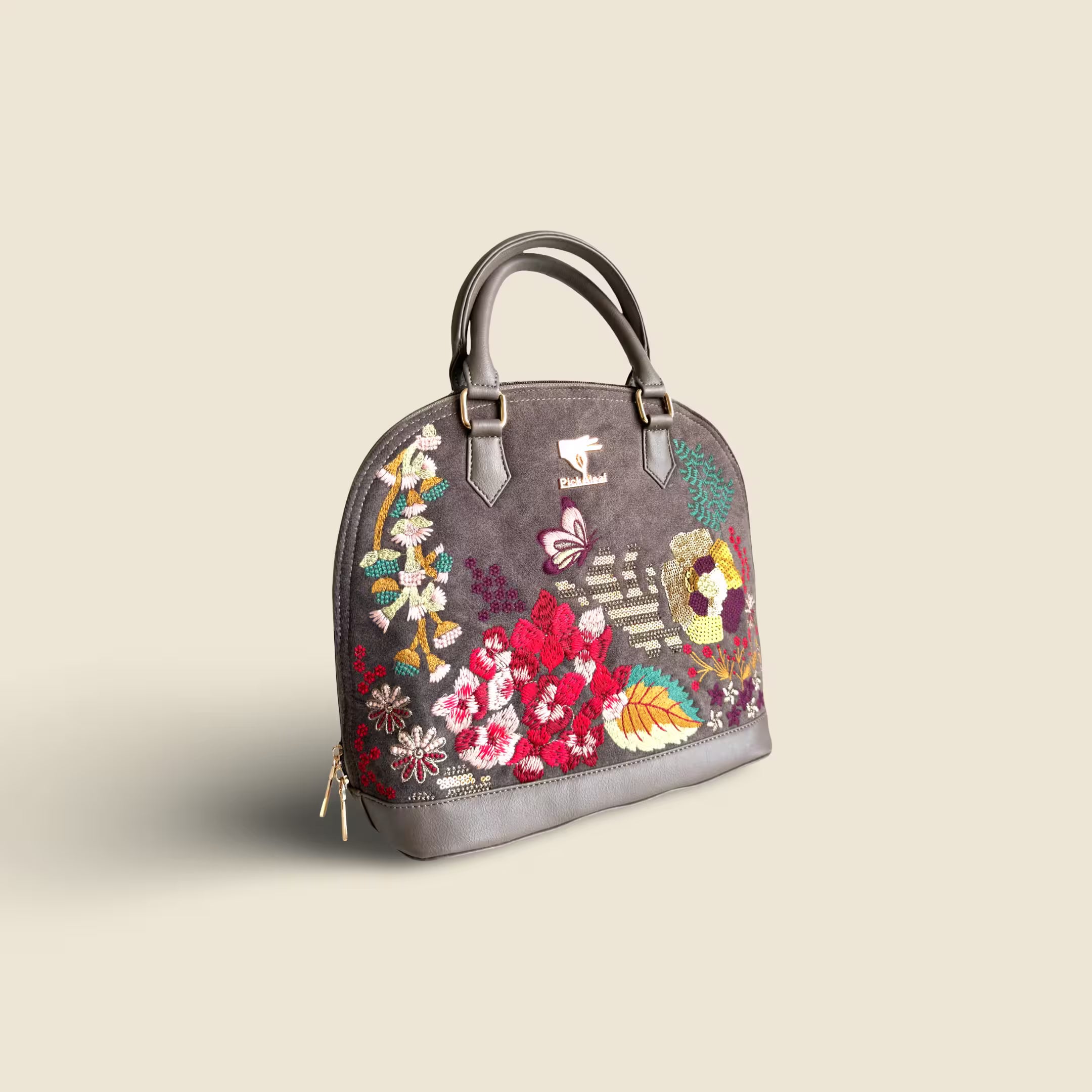 Grey floral vegan leather top handle bag from the Garden Grey Collection on a soft grey background