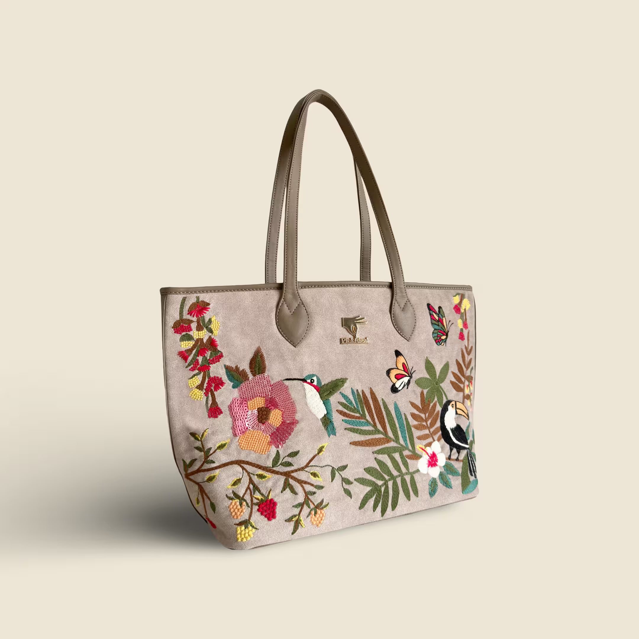 Beige embroidered large tote bag for women in vegan leather by PickAleaf with spacious design for travel, shopping and daily use