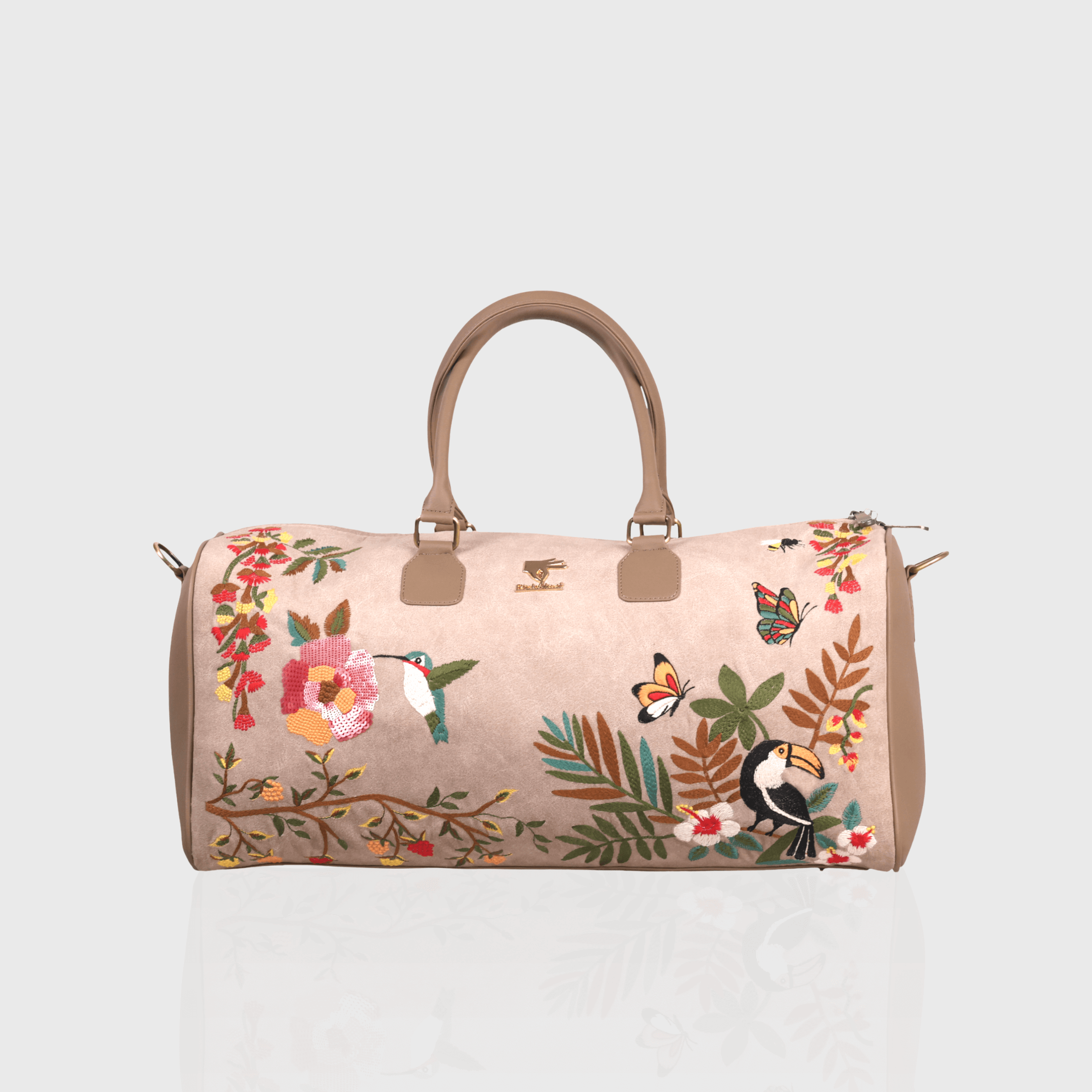 Beige Mystic Garden embroidered duffel bag.