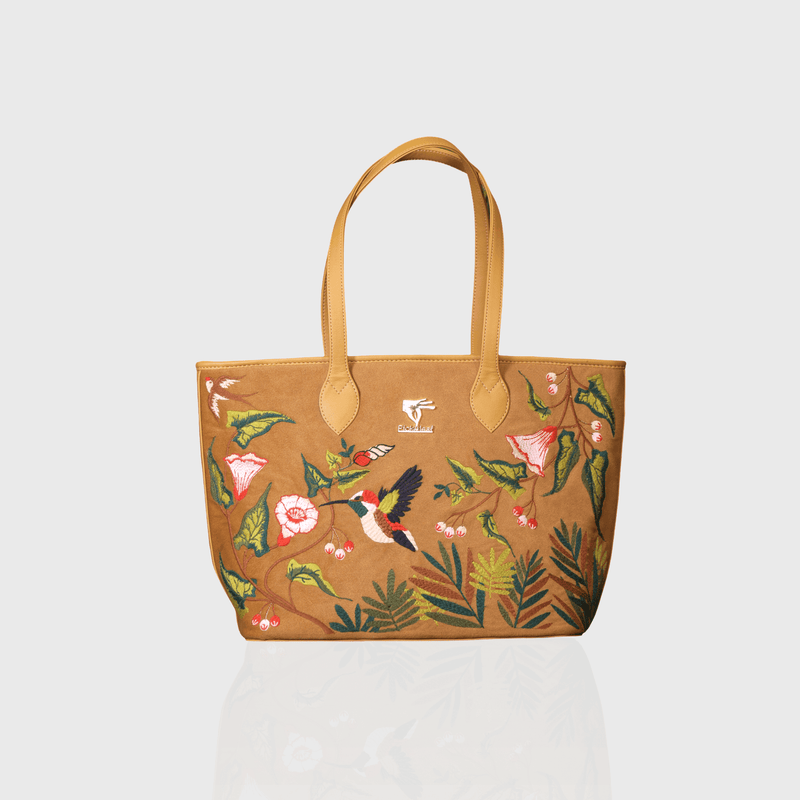 Gold Flora embroidered tote bag for travel and daily carry.