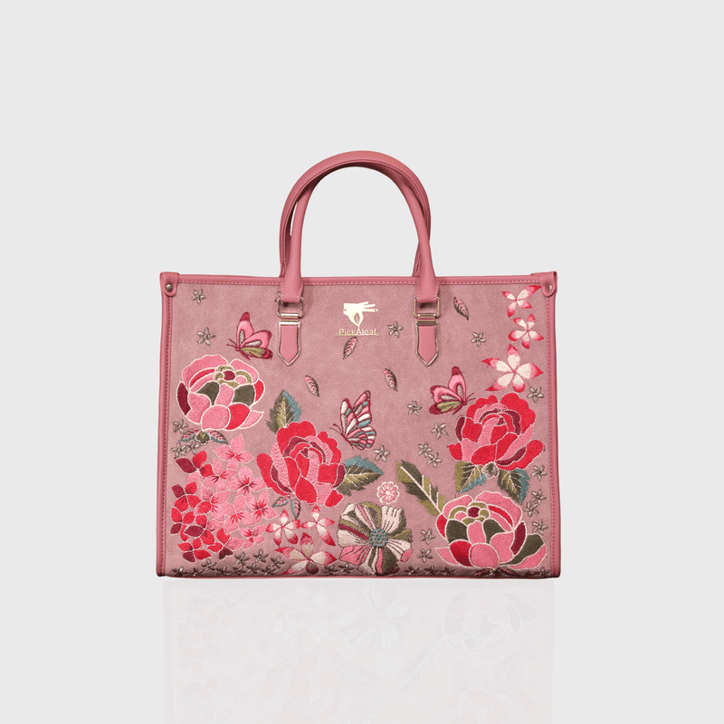 Pink vegan leather embroidered shoulder bag.