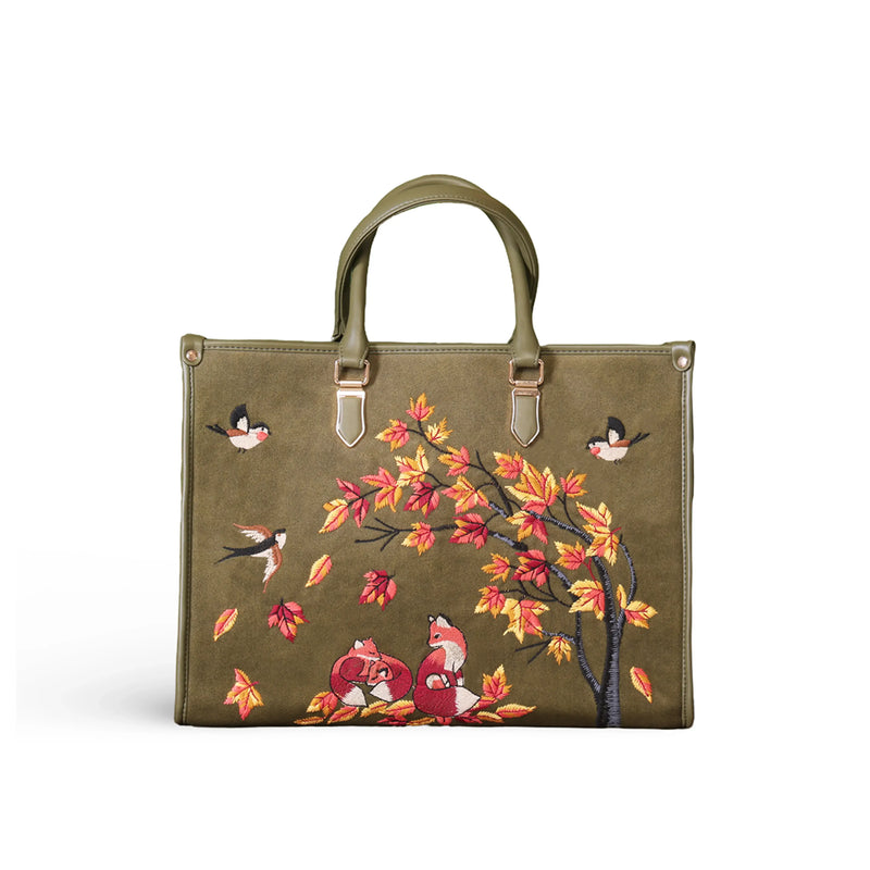 Olive green travel tote bag for women in cruelty free vegan leather by PickAleaf with embroidered design for travel and weekend use