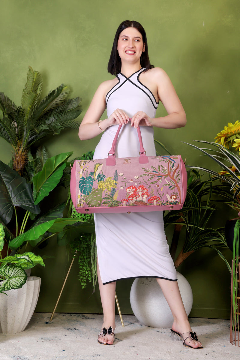 Pink Paradise embroidered duffel bag.