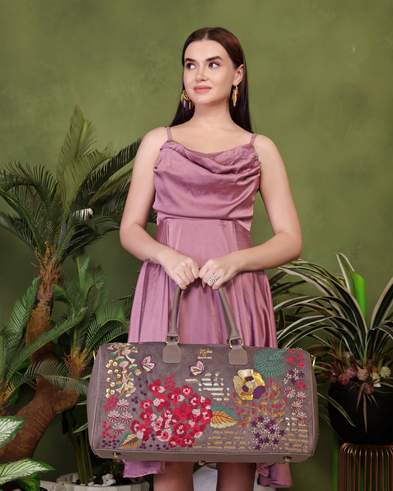 Grey Garden embroidered duffel bag.