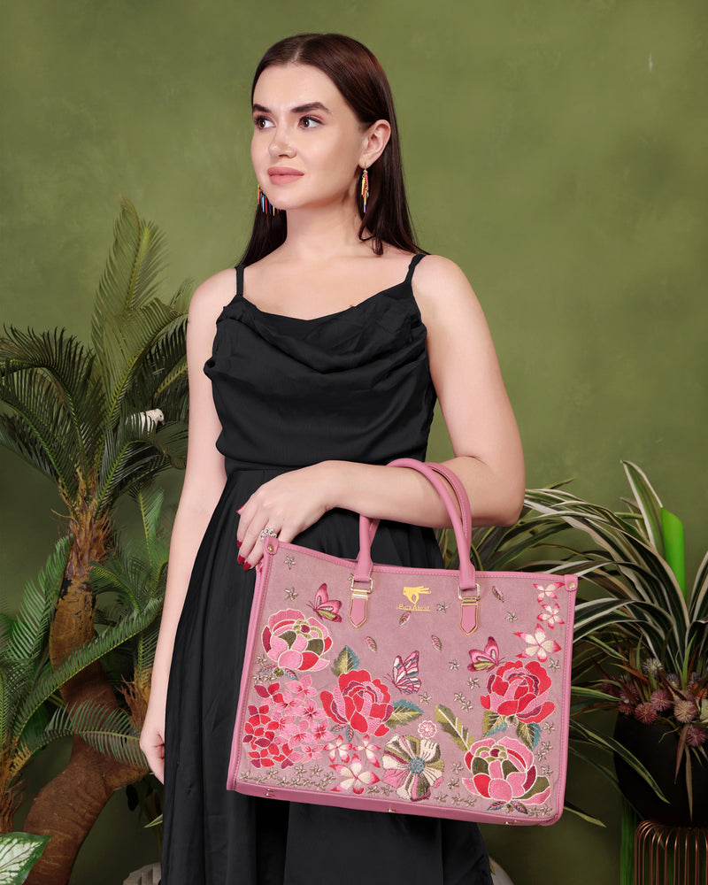 Pink vegan leather embroidered shoulder bag.