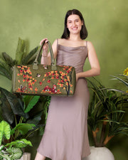 Olive green large travel duffel bag for women in cruelty free vegan leather by PickAleaf for weekend and cabin travel use