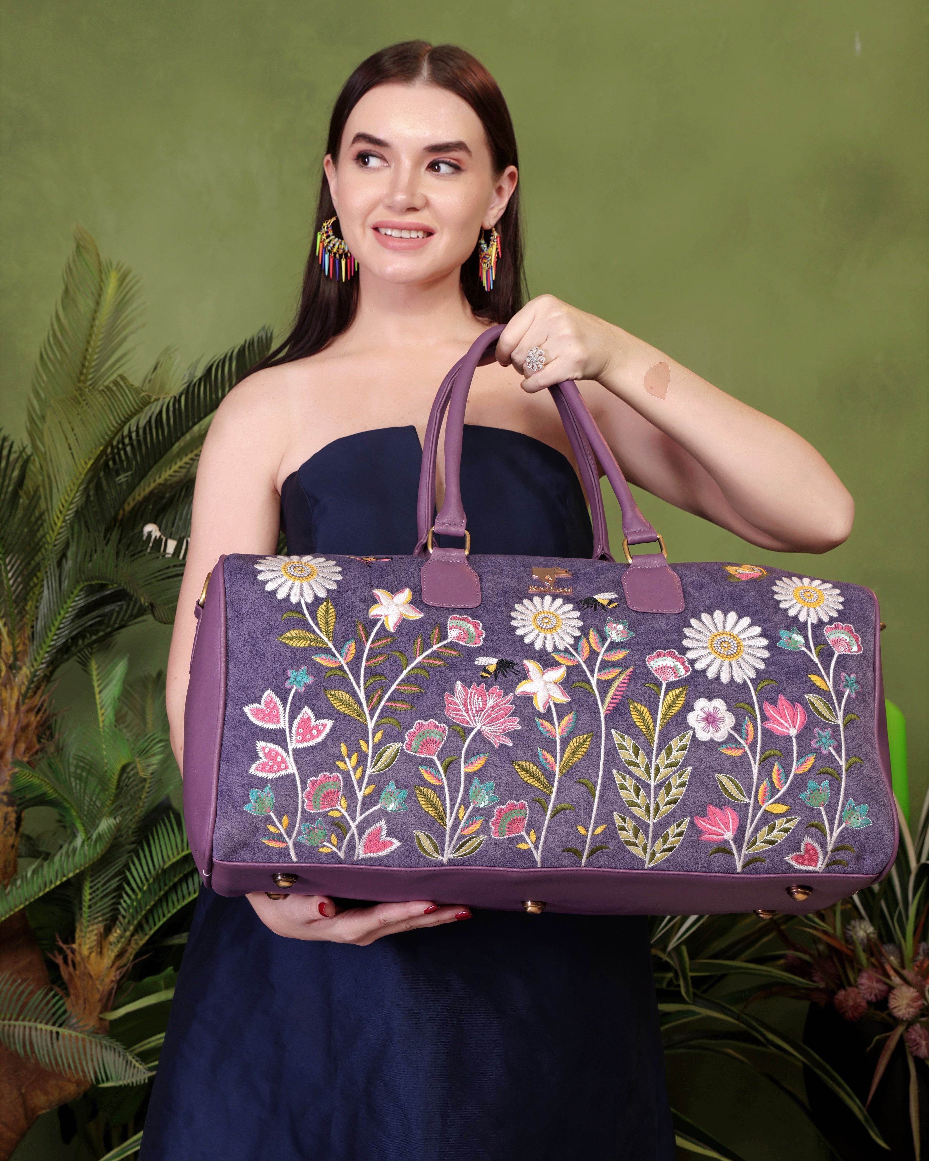 Purple travel duffel bag in cruelty free vegan leather by PickAleaf with embroidered design for cabin travel and weekend trips