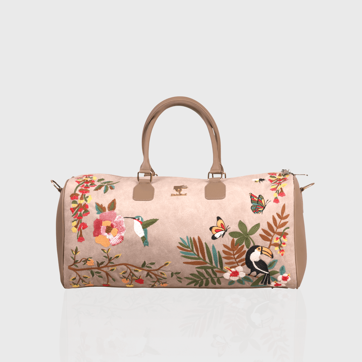 Beige Mystic Garden embroidered duffel bag.