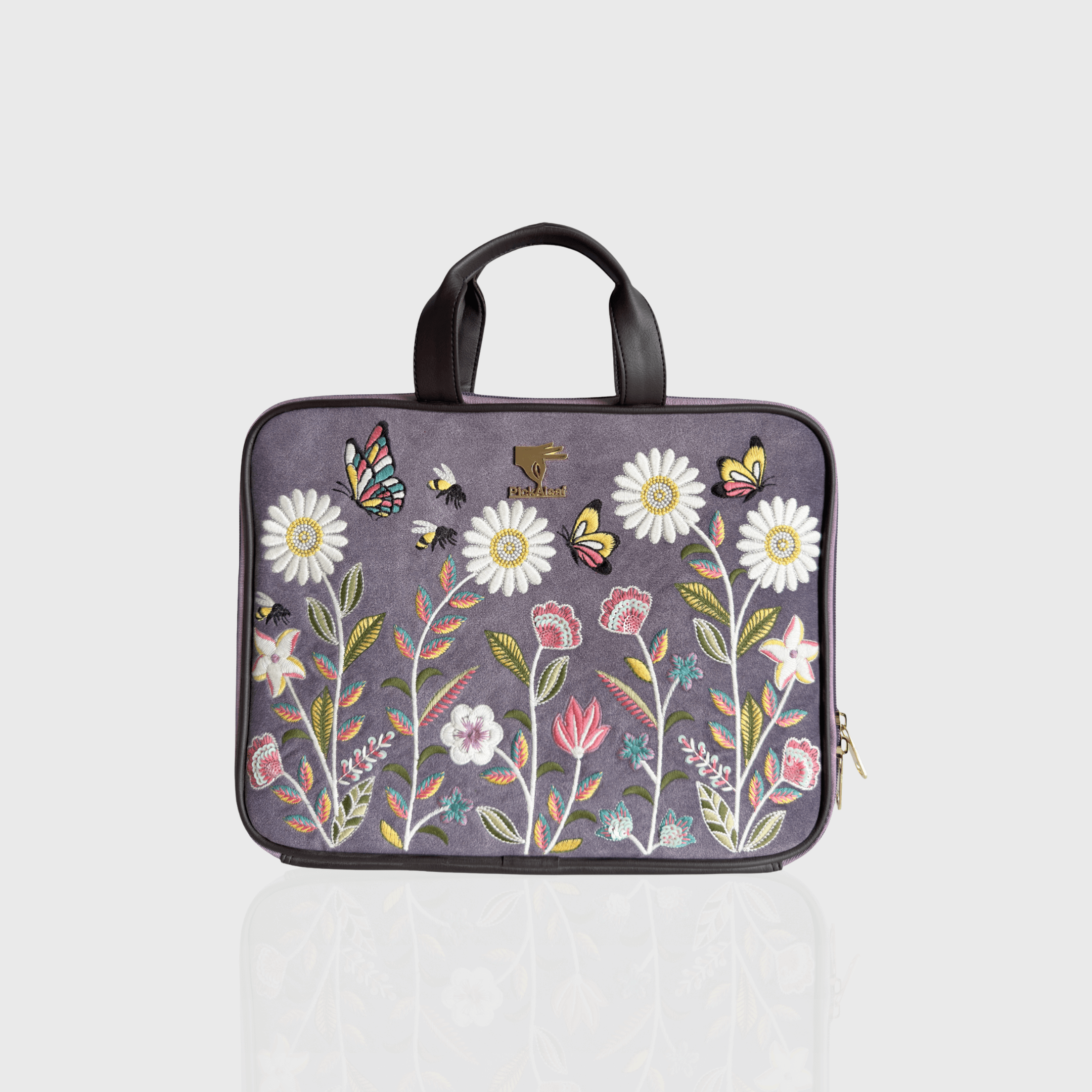 Purple Daisy Dream embroidered laptop sleeve.
