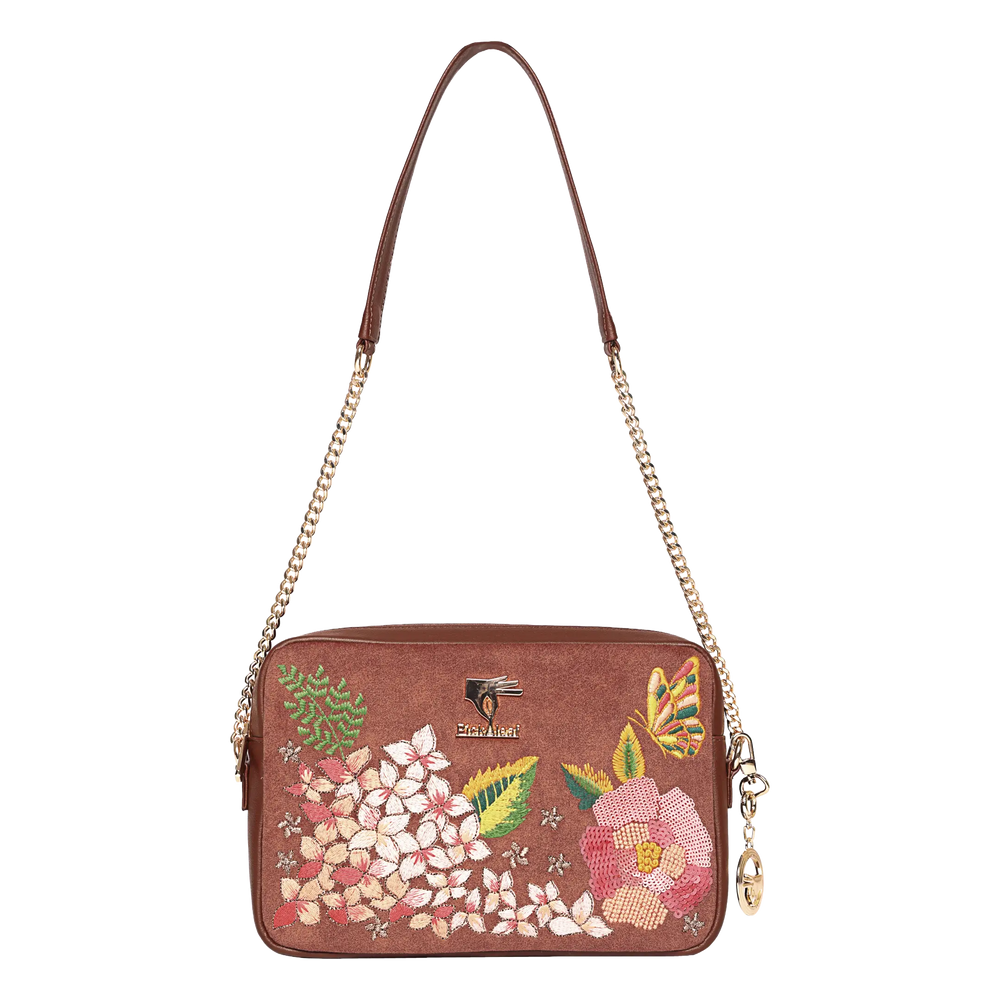 A brown suedeCrossbody bag with a floral and butterfly embroidery design on the front, featuring a gold-tone chain strap and a small hanging charm.